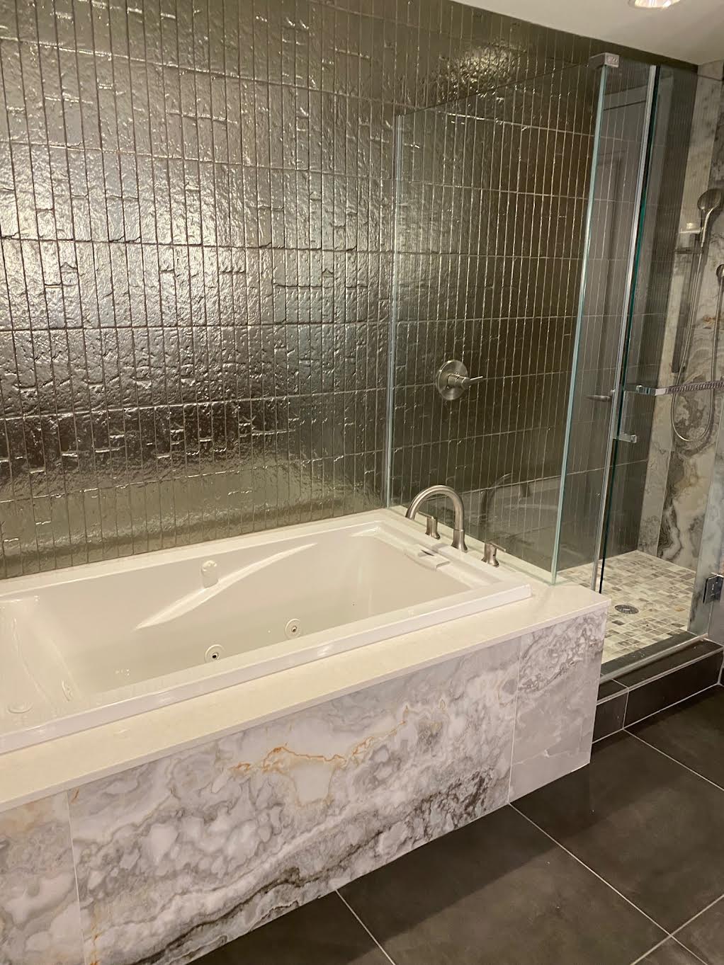 Luxury shower tile and marble tub surround